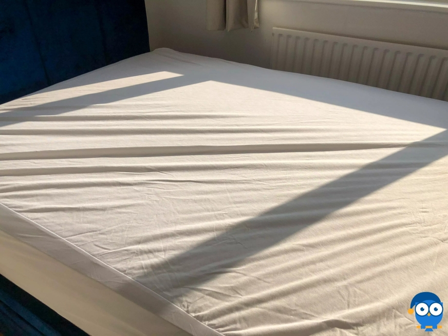 DreamCloud mattress protector on bed